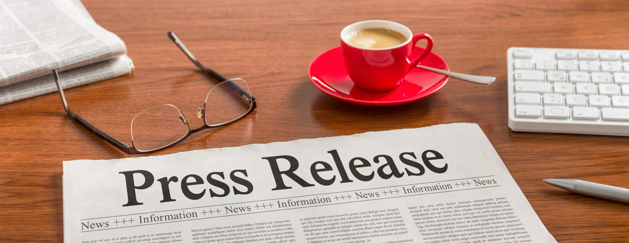 Image of a newspaper with the Headline of "Press Release" on it